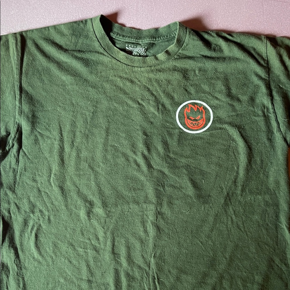 Spitfire wheels green tshirt it’s been skated in but no stains or rips!